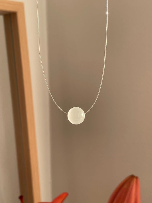 moonstone pendant on a seemless string, invisible necklace